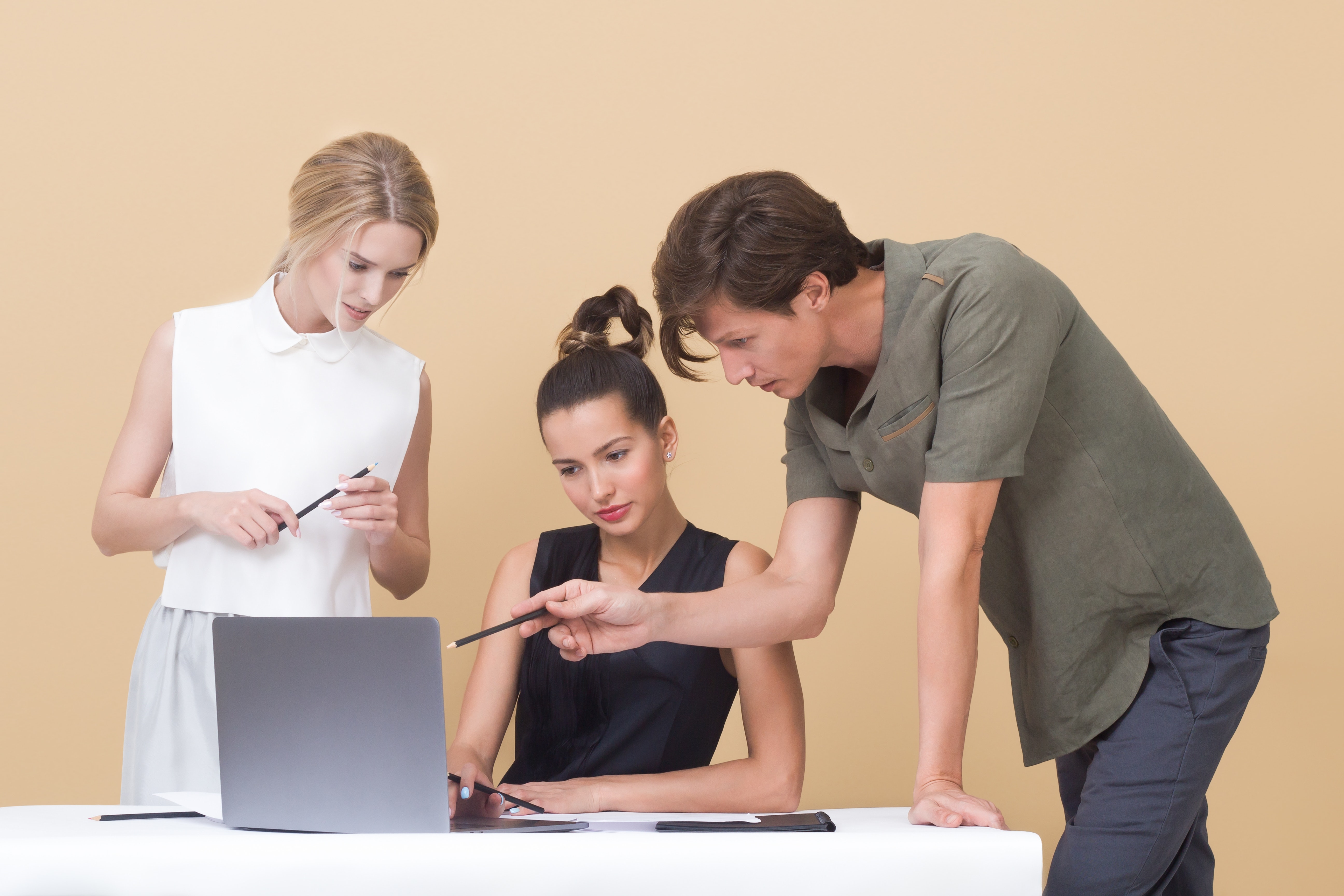 Adults discussion in front of computer